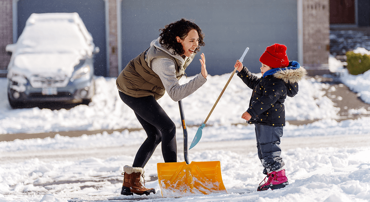A group of kids ride bicycles down a suburban street