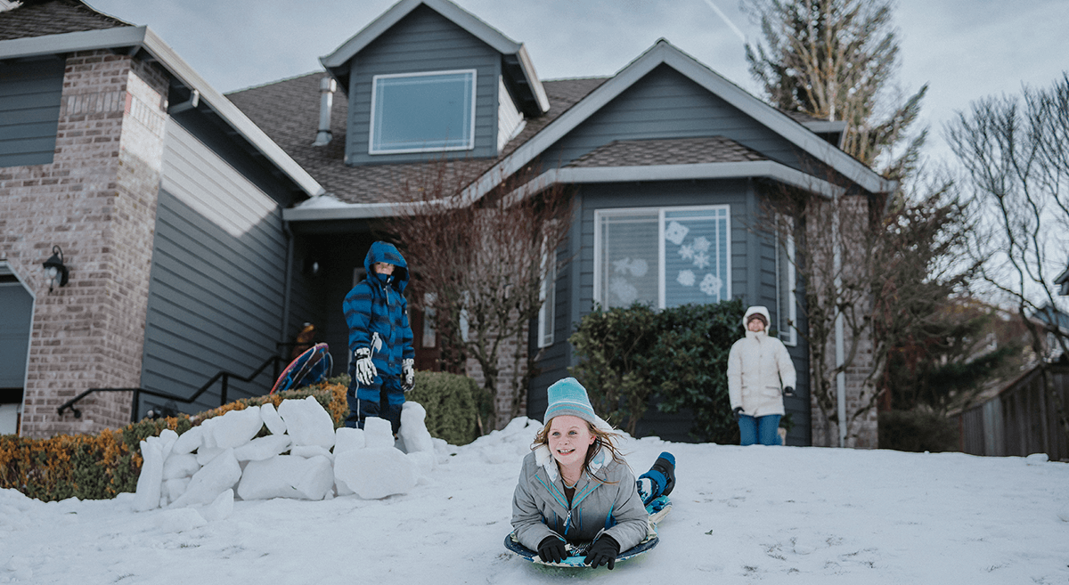 A group of children run across a field