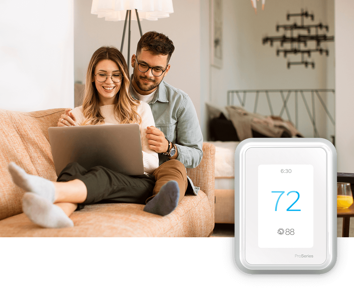 A young couple swings a child in the air of a bright living room; a thermostat image is in the foreground