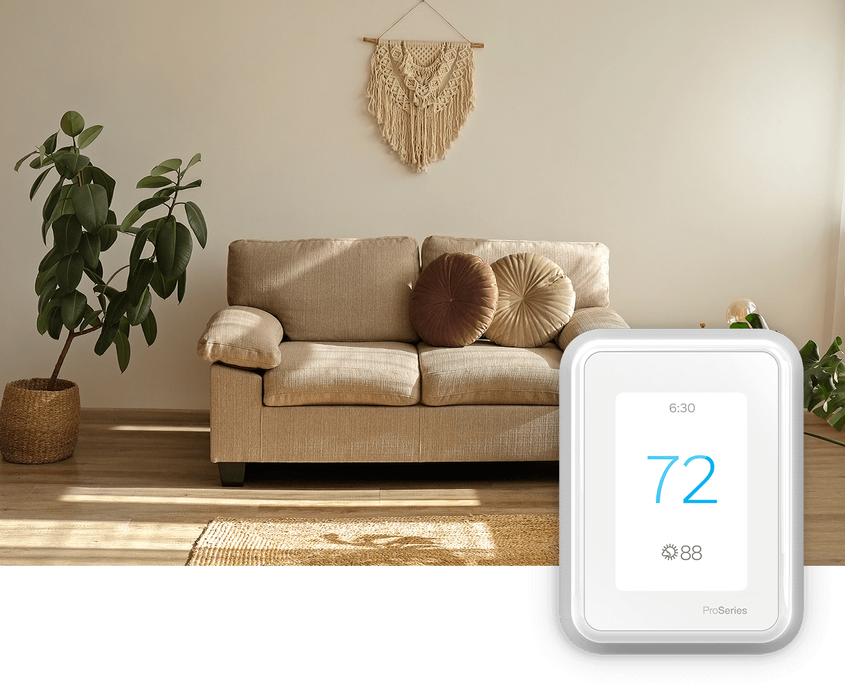 A modest living room, brightly lit; a thermostat image is in the foreground