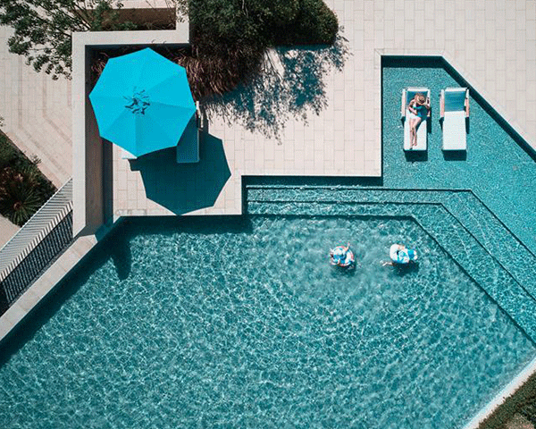 A spacious hotel suite with city view.