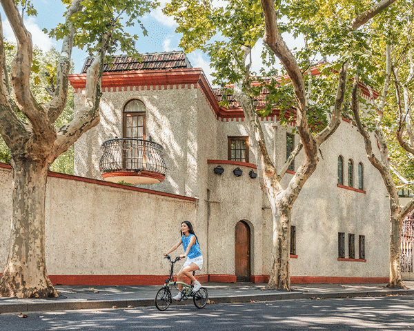 A woman explores Shanghai by bike.