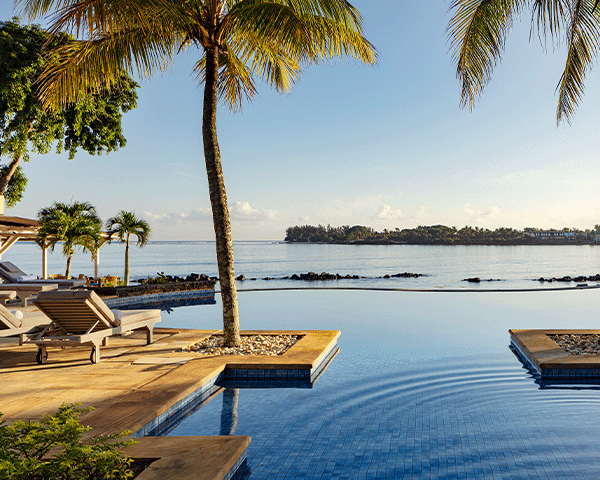 Sunset by an infinity pool in the Middle East.