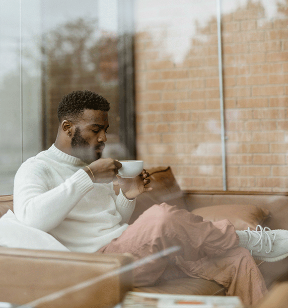 Man drinking coffee.
