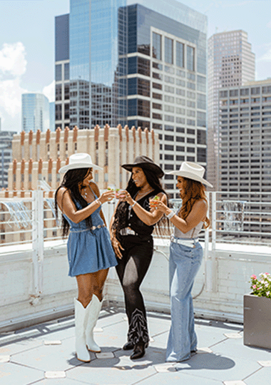 Lifestyle image of friends overlooking the city of Houston.