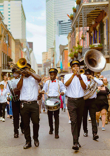 Lifestyle image of a parade on the streets of New Orleans.