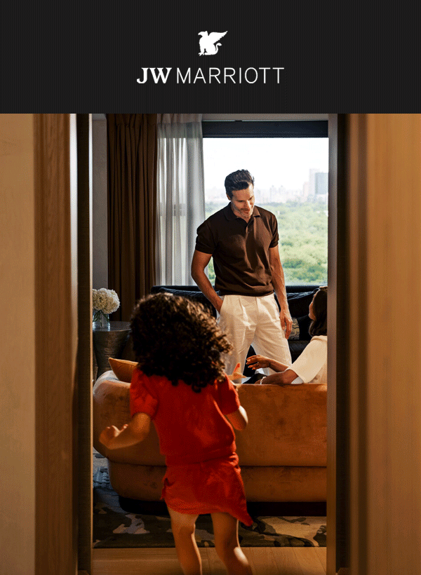 Father and daughter in a hotel room.