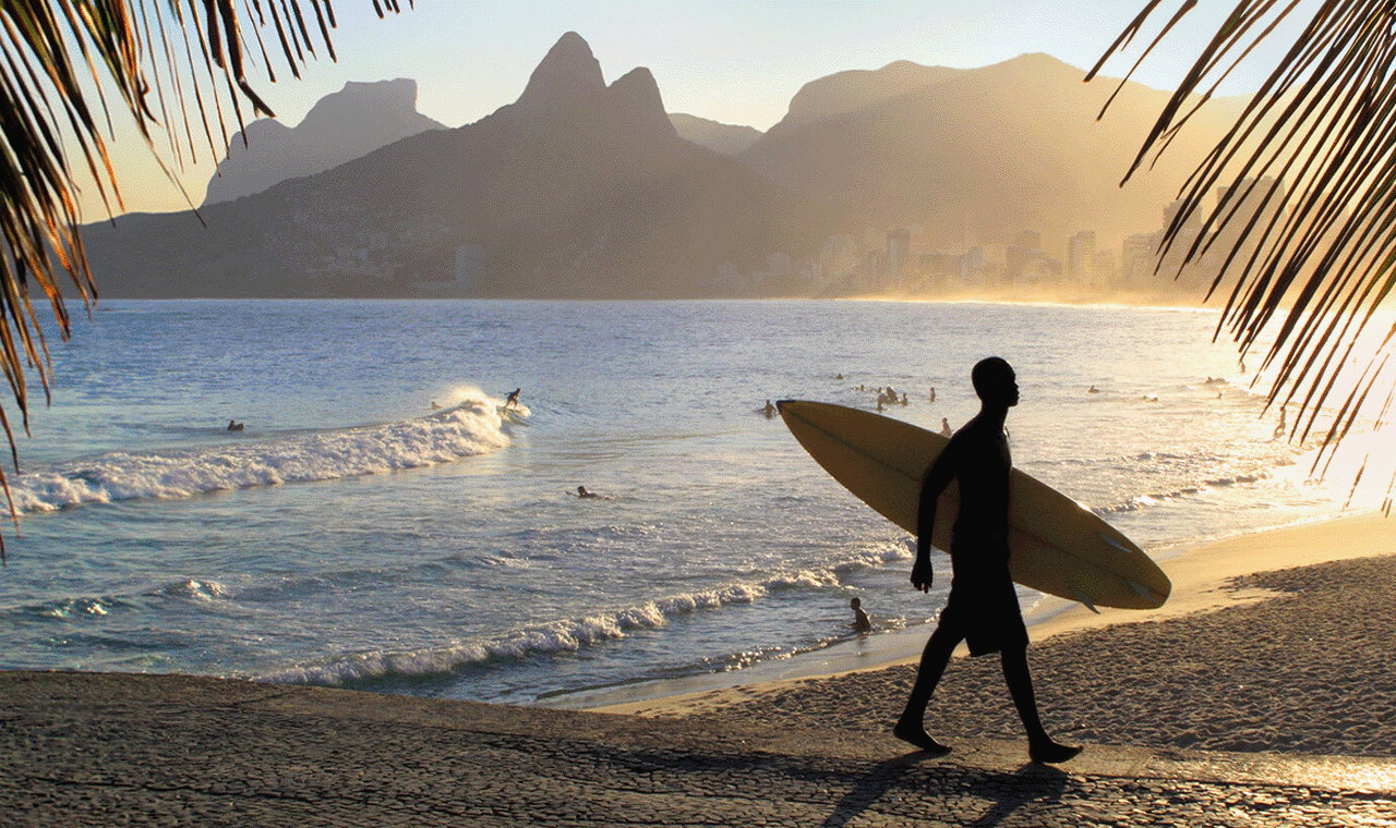 Lifestyle image of a surfer on the beach.