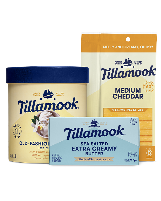 Packages of Tillamook Sour Cream, Salted Butter, Ice Cream, Sharp Shreds, Sharp Chunk, Original Cream Cheese, and Oregon Marionberry Yogurt lined up in a row.