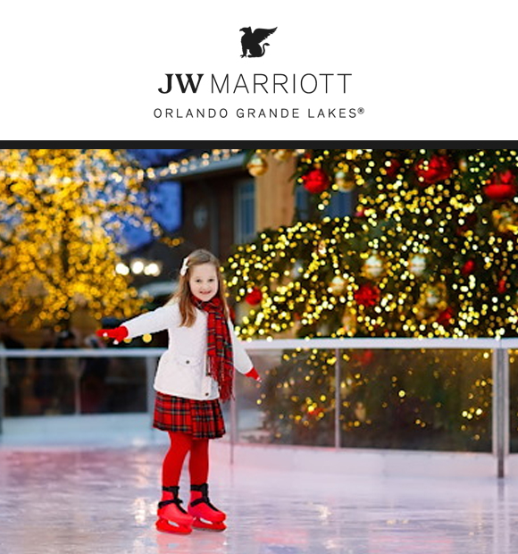 A young girl wearing a red plaid dress and scarf skates on an ice rink, smiling joyfully. Background features festive holiday lights and a large, decorated Christmas tree.