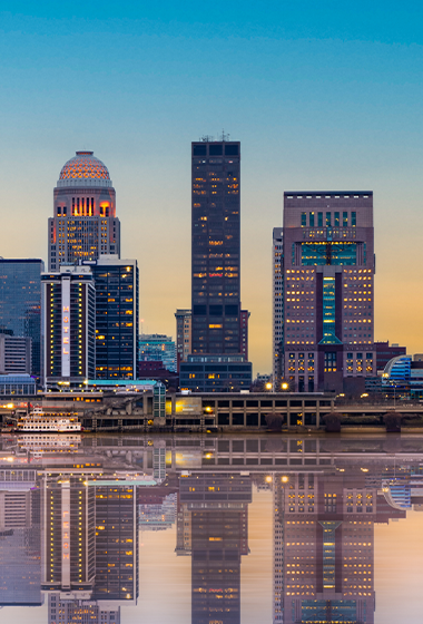 Twilight view of the Louisville city skyline.