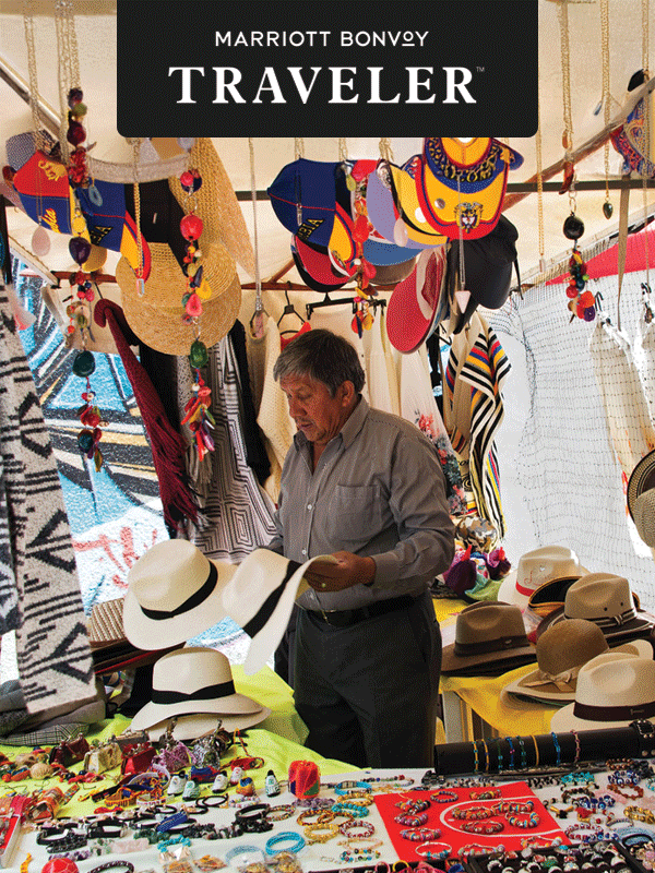 A man views hats at a flea market in Colombia.