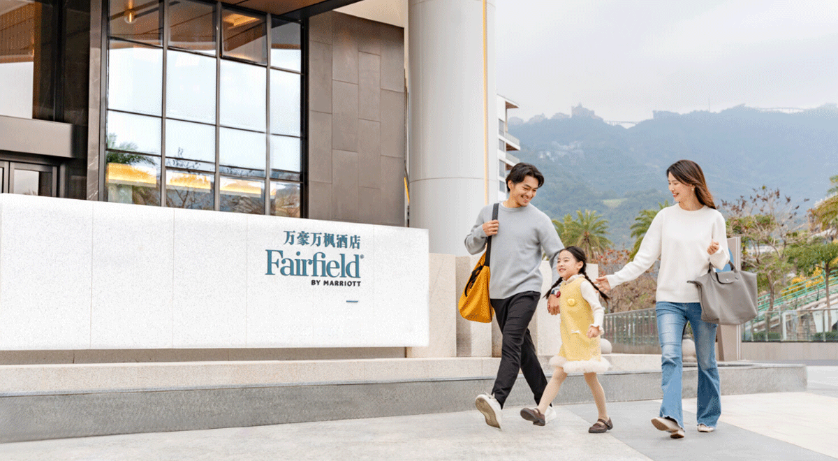Happy family staying at a Fairfield by Marriott property.