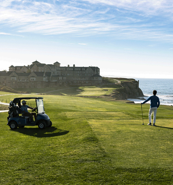 Animated GIF of a hotel exterior with the beach in the background and a man on a golf course.