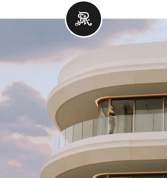 Animated GIF: Woman in sunglasses and patterned dress sits by the ocean followed by a woman standing at a balcony of modern curved building at sunset.