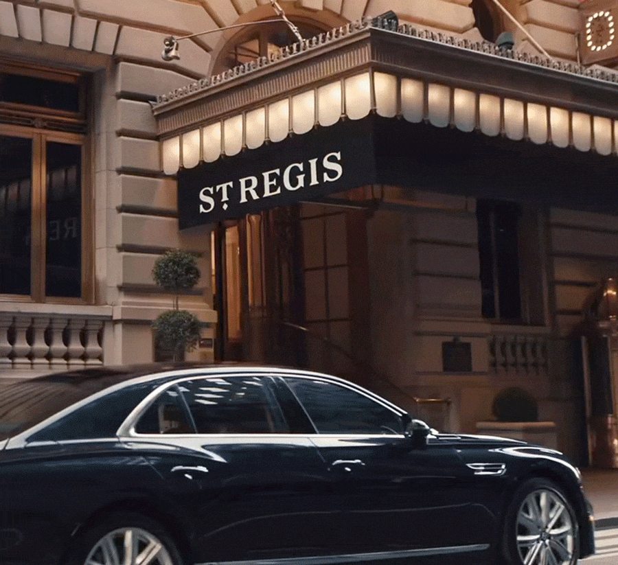 Animated Video GIF of a car pulling up to the St. Regis New York, a woman ringing the service bell at the front desk, a person pouring maple syrup on waffles with respberries, and a cup of coffee on a windowsill in the morning