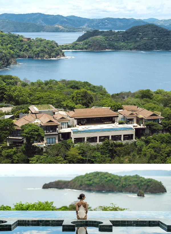 A luxurious, tropical villa overlooks a serene, blue bay surrounded by lush green hills. Below, a woman gazes over an infinity pool.